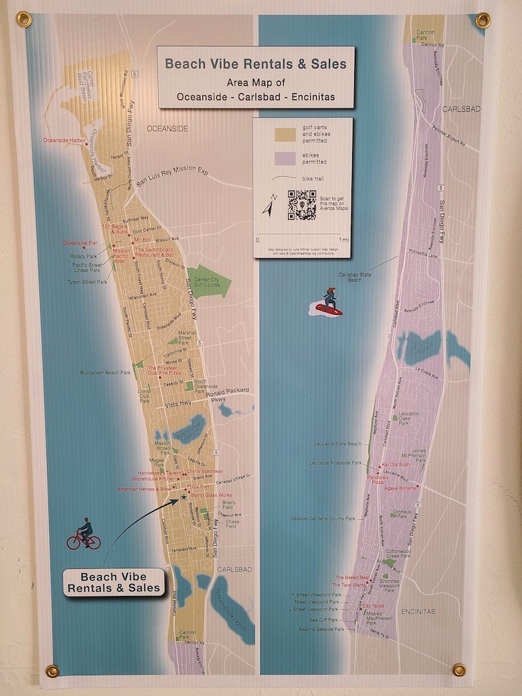 Poster map of Carlsbad, Oceanside, and Encinitas on wall of Beach Vibe